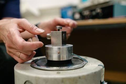 A close up shot of an accelerometer being calibrated 