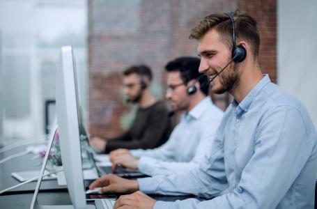 Man on phone in customer support centre