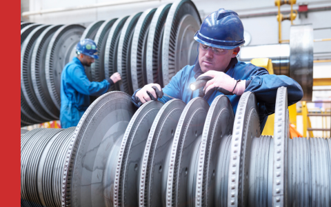 Engineers on power plant inspecting machinery