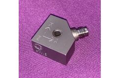 An A/15 accelerometer shot in purple background