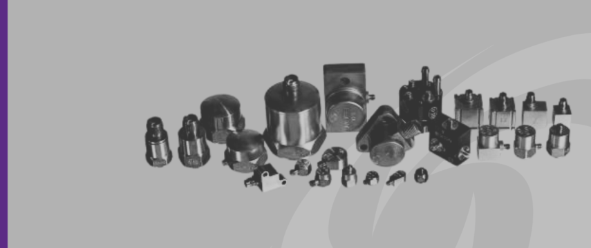 Image shows a range of accelerometers and accessories against grey background