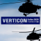 Two helicopters in the air with the Verticon 2025 show logo