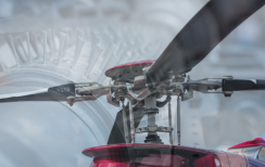 Helicopter blades close up with turbine behind